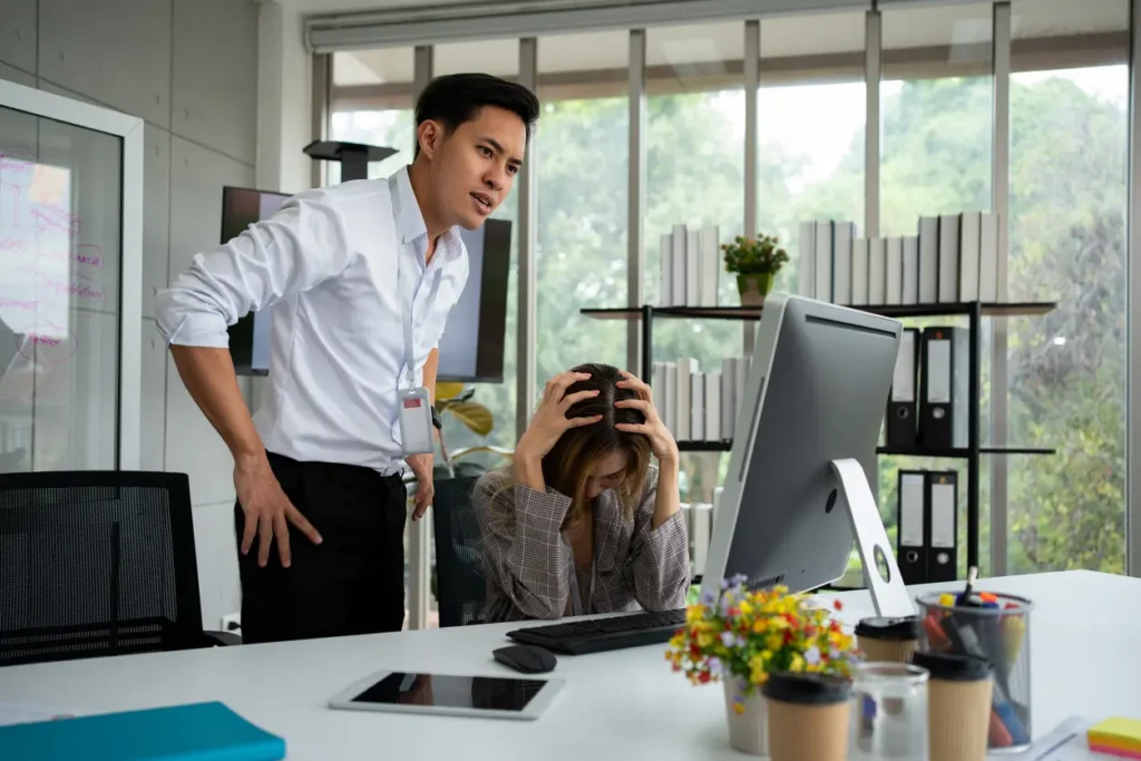 Stressed of female employee and offensive faces that the boss yells, Workplace Conflict, Corporate Communication Problem, stress of business partner discussing, Quarrels, And Bad Attitude At Work